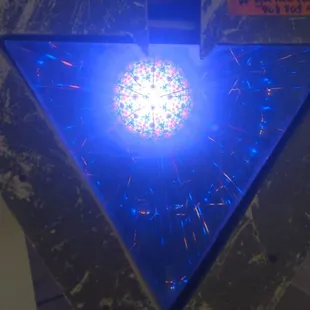 a blue light in a triangle