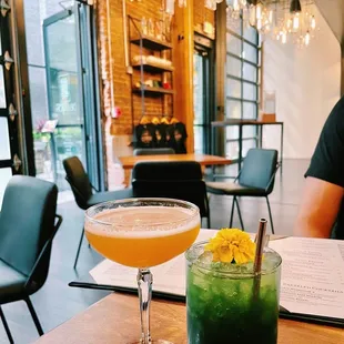 two cocktails on a table