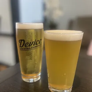 two glasses of beer on a table