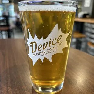 a glass of beer on a table