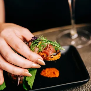 a person holding a plate of food
