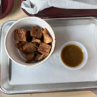 Cracklings with sauce