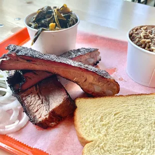 Ribs and brisket with greens and dirty rice.