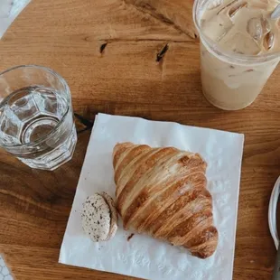 Butter croissant, cookies and cream macaroon, and iced almond latte