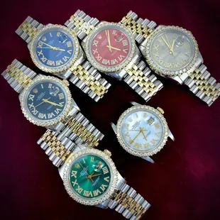 a group of watches with roman numerals