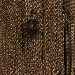 a close up of a gold tie