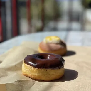 two donuts on a table