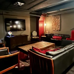 Downstairs speakeasy feel with ample places to sit and sip