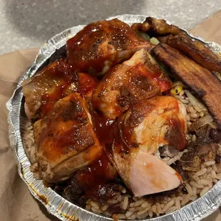 Jerk chicken with chicken gravy over the peas and rice and veg.