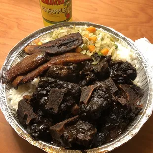 Large Oxtails with white rice, cabbage, plantain and Jamaica soda