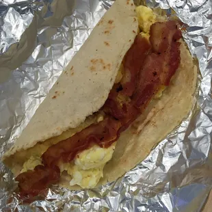 Bacon and egg taco on homemade corn tortilla