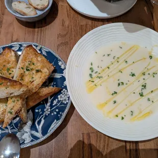 Garlic bread nubbins and cauliflower soup of the day.