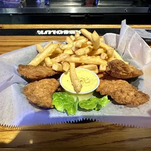 Chicken tenders with fries.