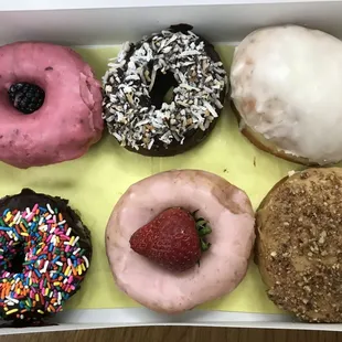 clockwise from top left: raspberry-blackberry, chocolate coconut, lemon meringue, espresso, strawberry, chocolate sprinkles