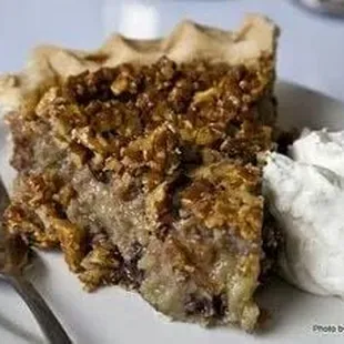 a slice of pie and whipped cream