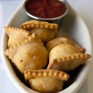 a bowl of empanadas