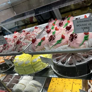 a variety of cakes on display