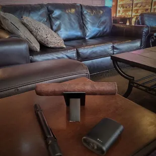 a leather couch and a cigar