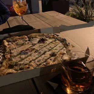 a box of pizza and a drink