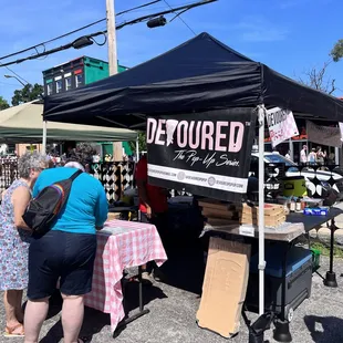 a crowd of people at a market
