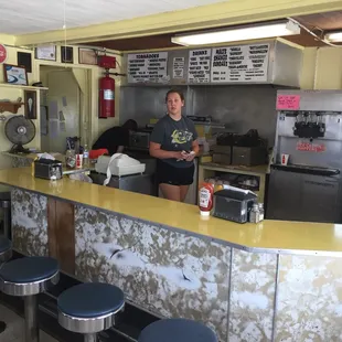 a woman standing at the counter