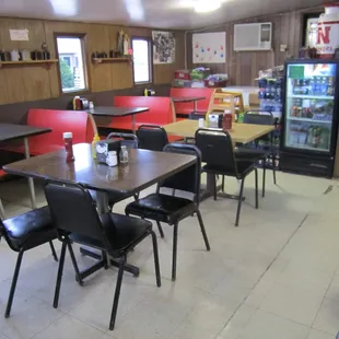 a restaurant with tables and chairs