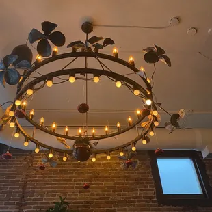 a circular chandelier hanging from the ceiling