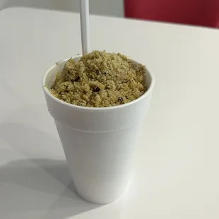 a drink in a paper cup