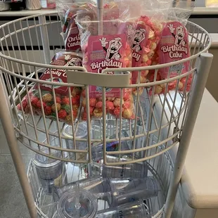 a shopping cart filled with snacks