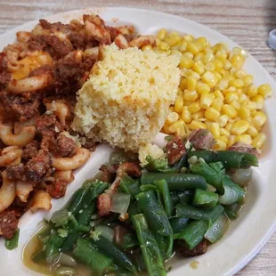 Lunch special Goulash, green beans with bacon pieces, corn, and a good square of cornbread.