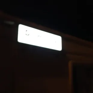 a street sign at night