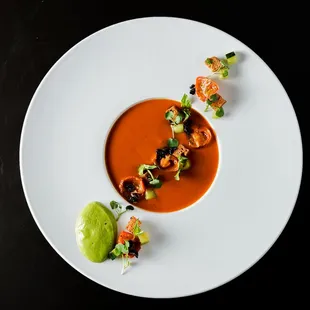 Roasted Tomato-Bell Pepper Gazpacho with Pesto, kalamata olive, grilled cucumber, grilled tomatoes