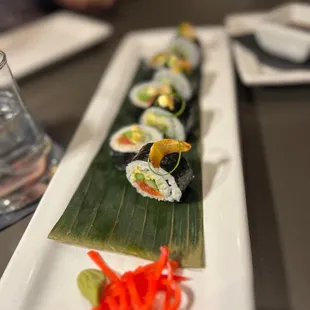 a long plate of sushi