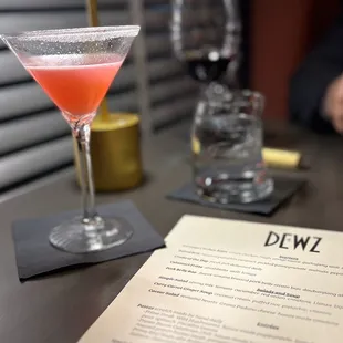 a pink drink in a martini glass