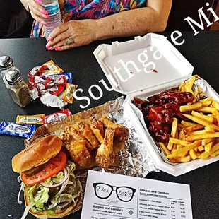 a woman sitting at a table with a tray of food