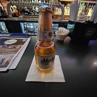 a bottle of beer on a table