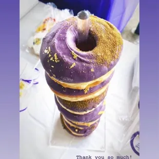a purple donut with sprinkles