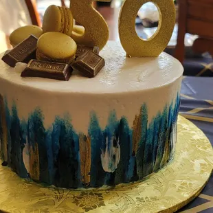 This is a vanilla cake with strawberry filling and buttercream Frosting.