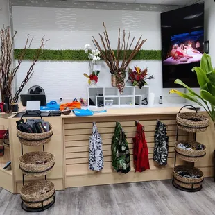 Neck ties in the baskets and tote bags hanging under the countertop