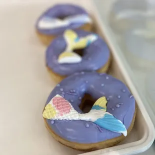a row of decorated donuts