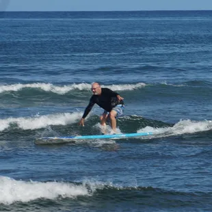 Even dad is catching waves! Any age any swimming capabilty accepted. www. dfcsurf.com for more info.