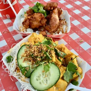 two plates of food on a checkered tablecloth