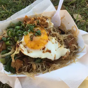 Scholar with egg, minus a bite.