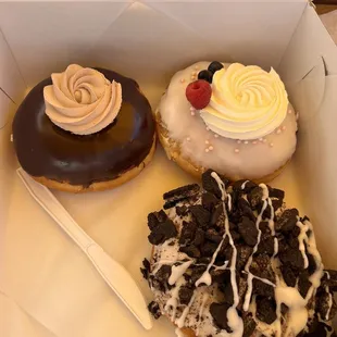 three different flavored donuts