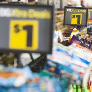 a grocery store with a price sign in the foreground
