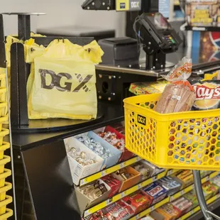 a woman pushing a shopping cart in a store