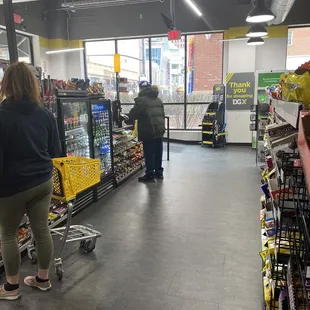 people shopping in a grocery store