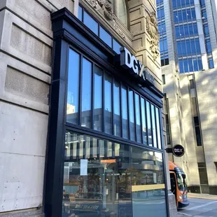 Store entrance, understated on a fancy historic building