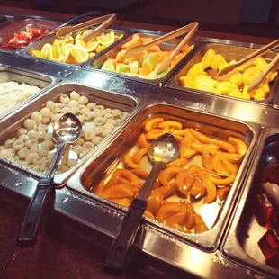 a variety of food items in a buffet