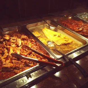 a variety of food items in a buffet